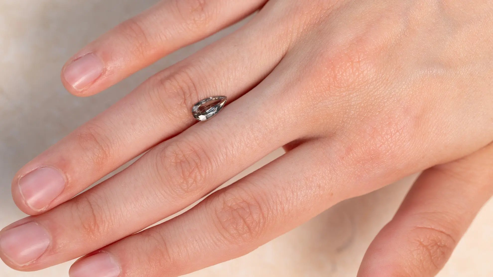 Wyatt-Jewellery-green-sapphire-pear-shape-hand-S010